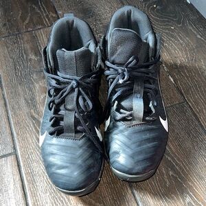 Nike  Alpha Black Cleats with White Swoosh.